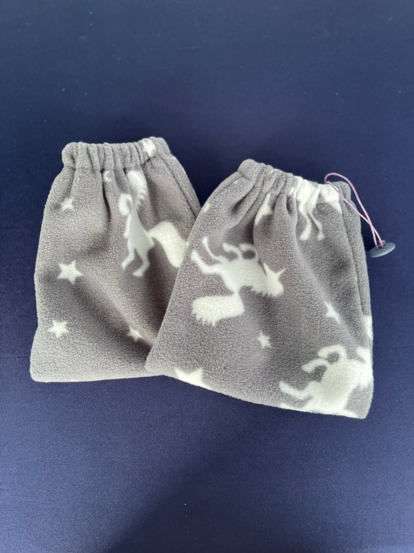 grey stirrup covers with white unicorns on them