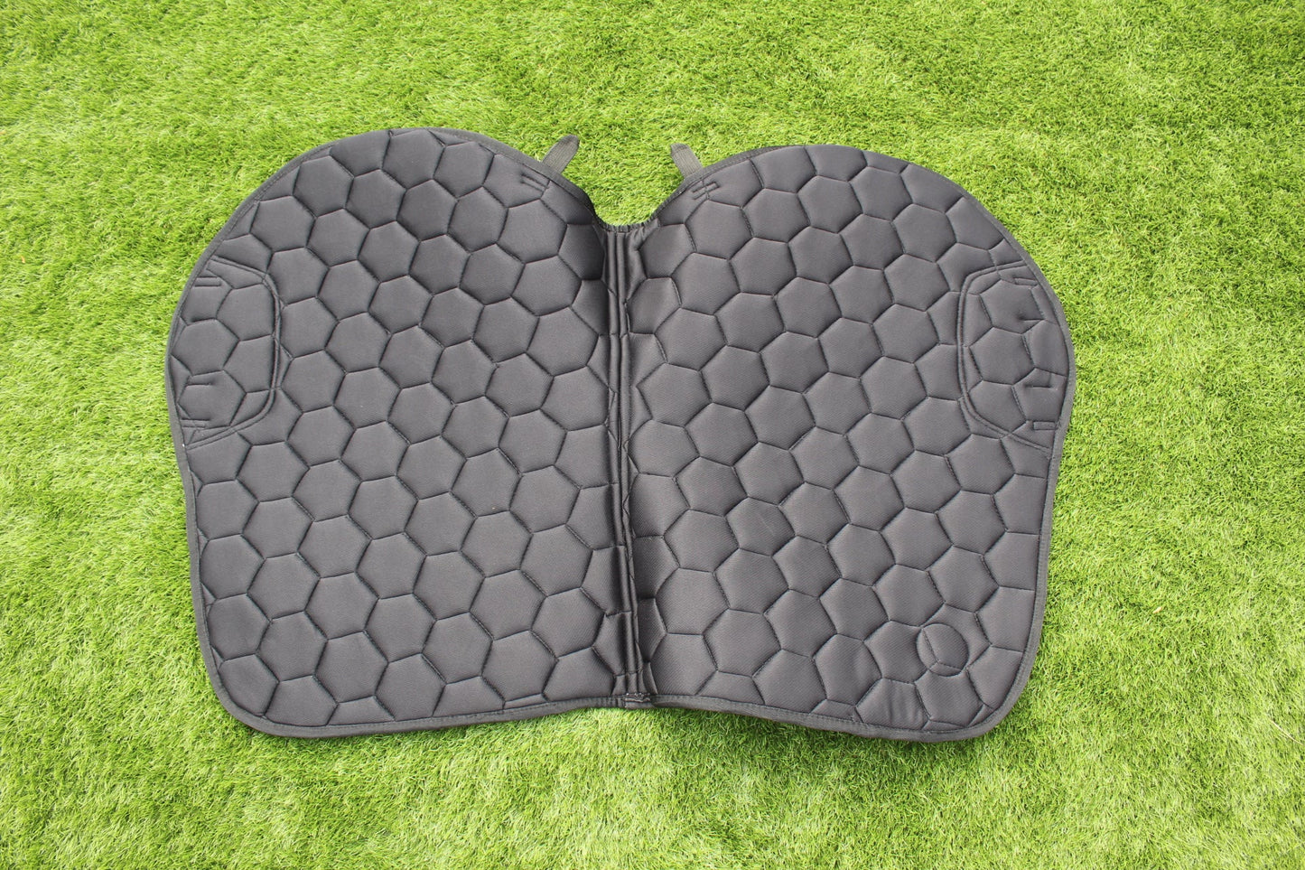 Luxury black suede competition saddle pad numnah with white piping and diamontés on it.