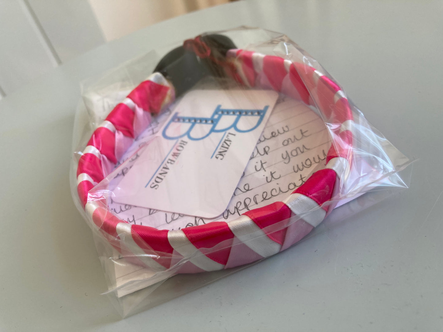 a hot pink, light pink and white coloured bespoke browband