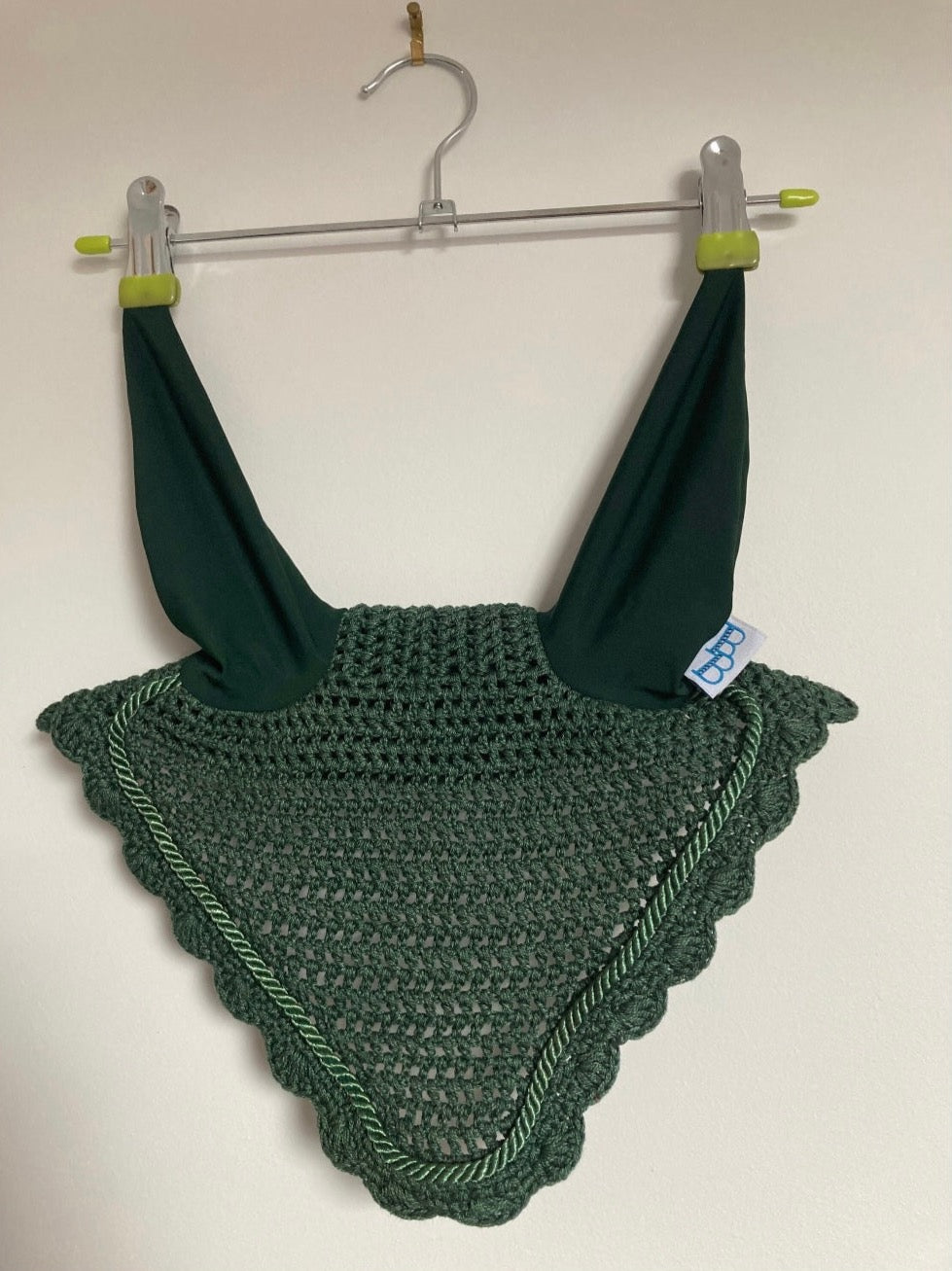 a hunter green ear bonnet