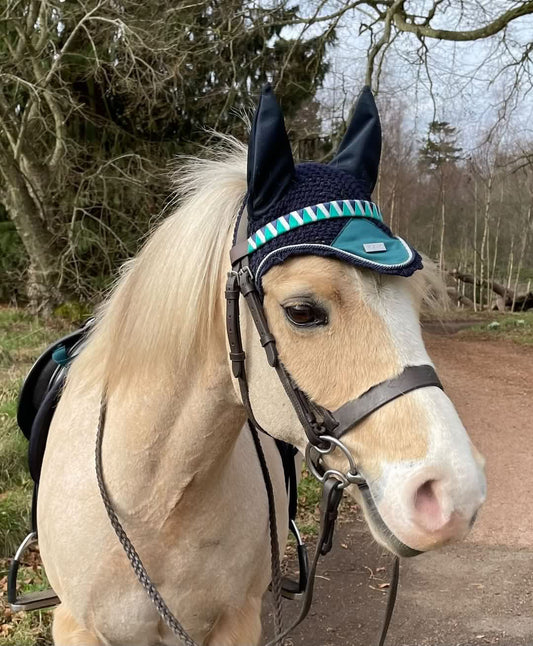 How to look after browbands like this handmade bespoke browband with Equestrian Stockholm's peacock ear bonnet