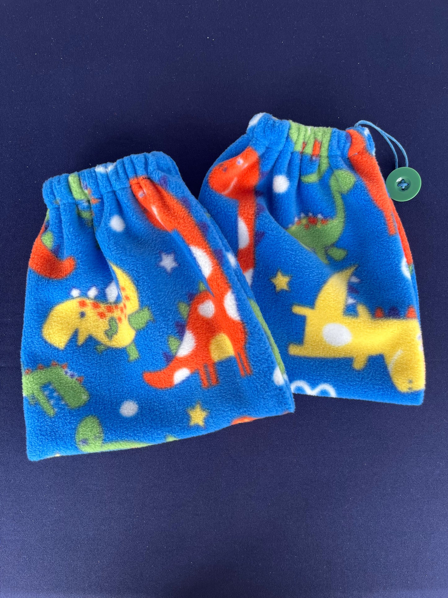 blue stirrup covers with different colour and sized dinosaurs on them