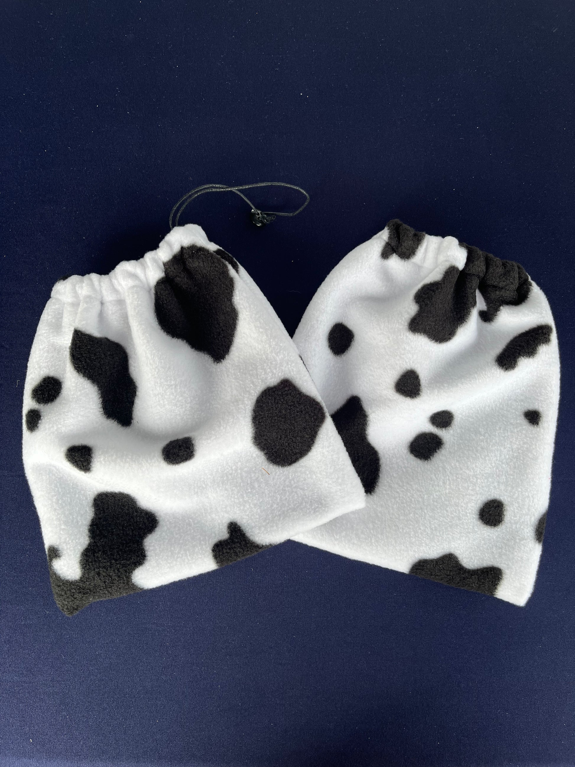 black and white cow print stirrup covers