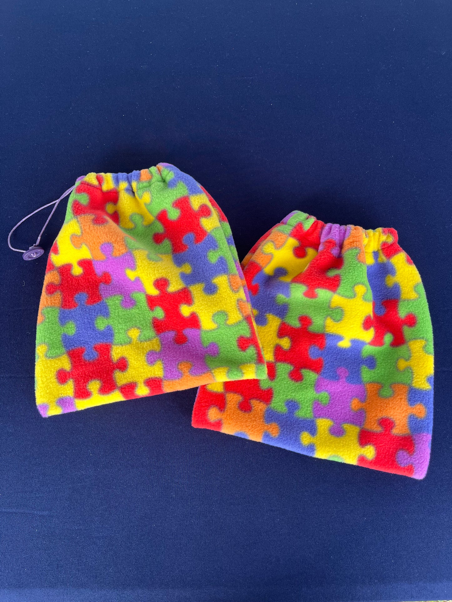 stirrup covers with different coloured jigsaw pieces on them
