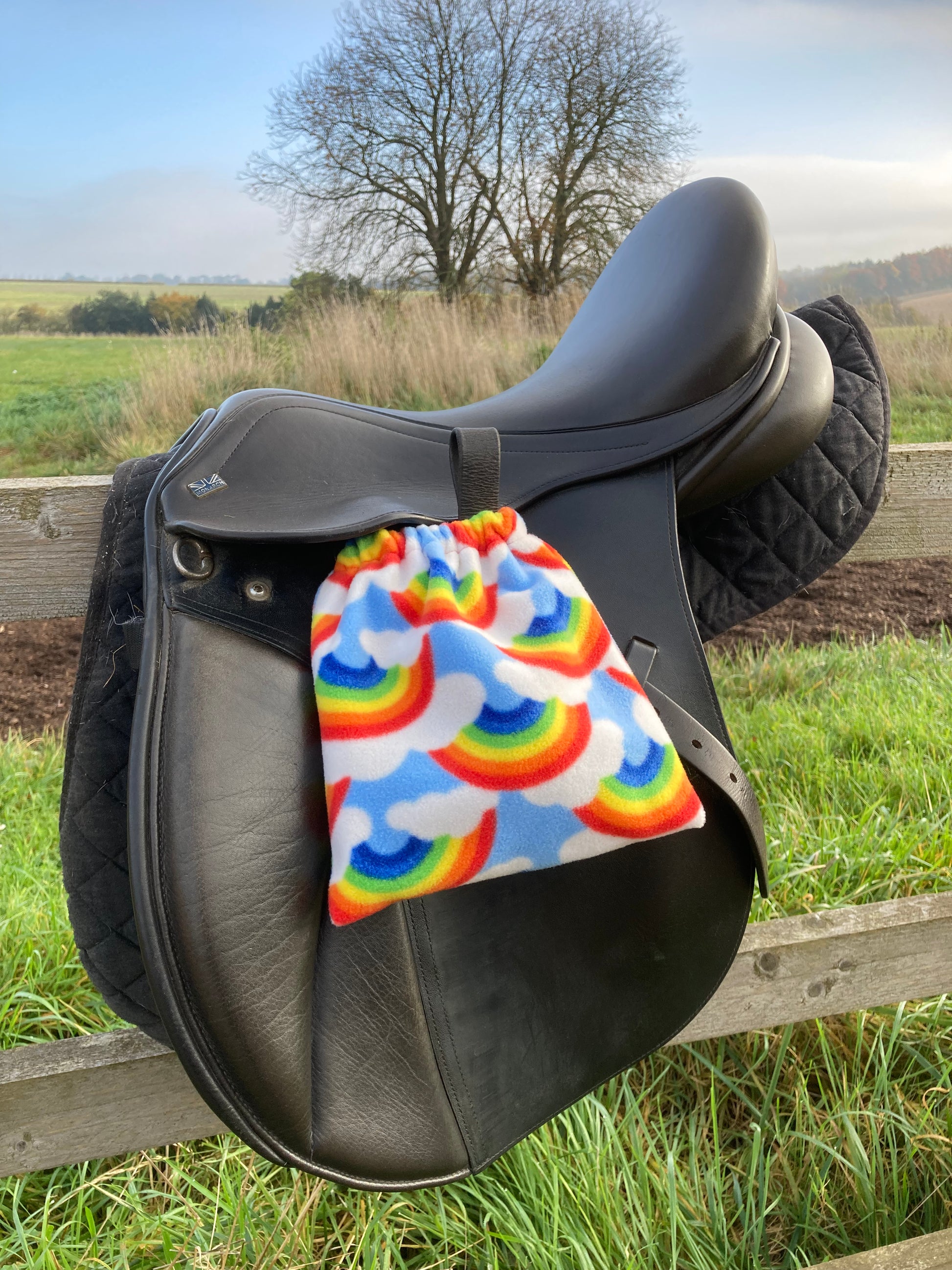 rainbow stirrup covers on the stirrups attached to a saddle