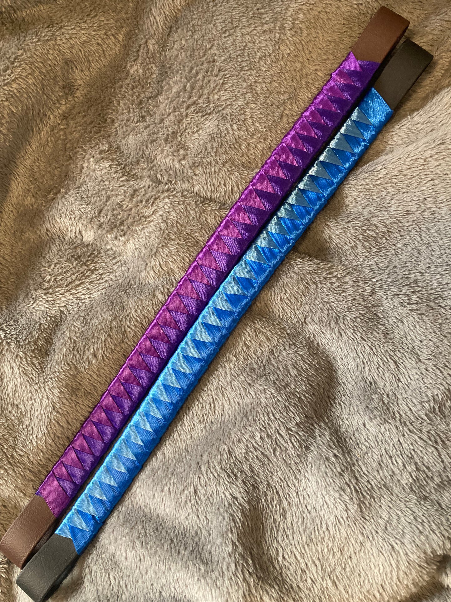 a two toned blue bespoke browband and a two toned purple browband
