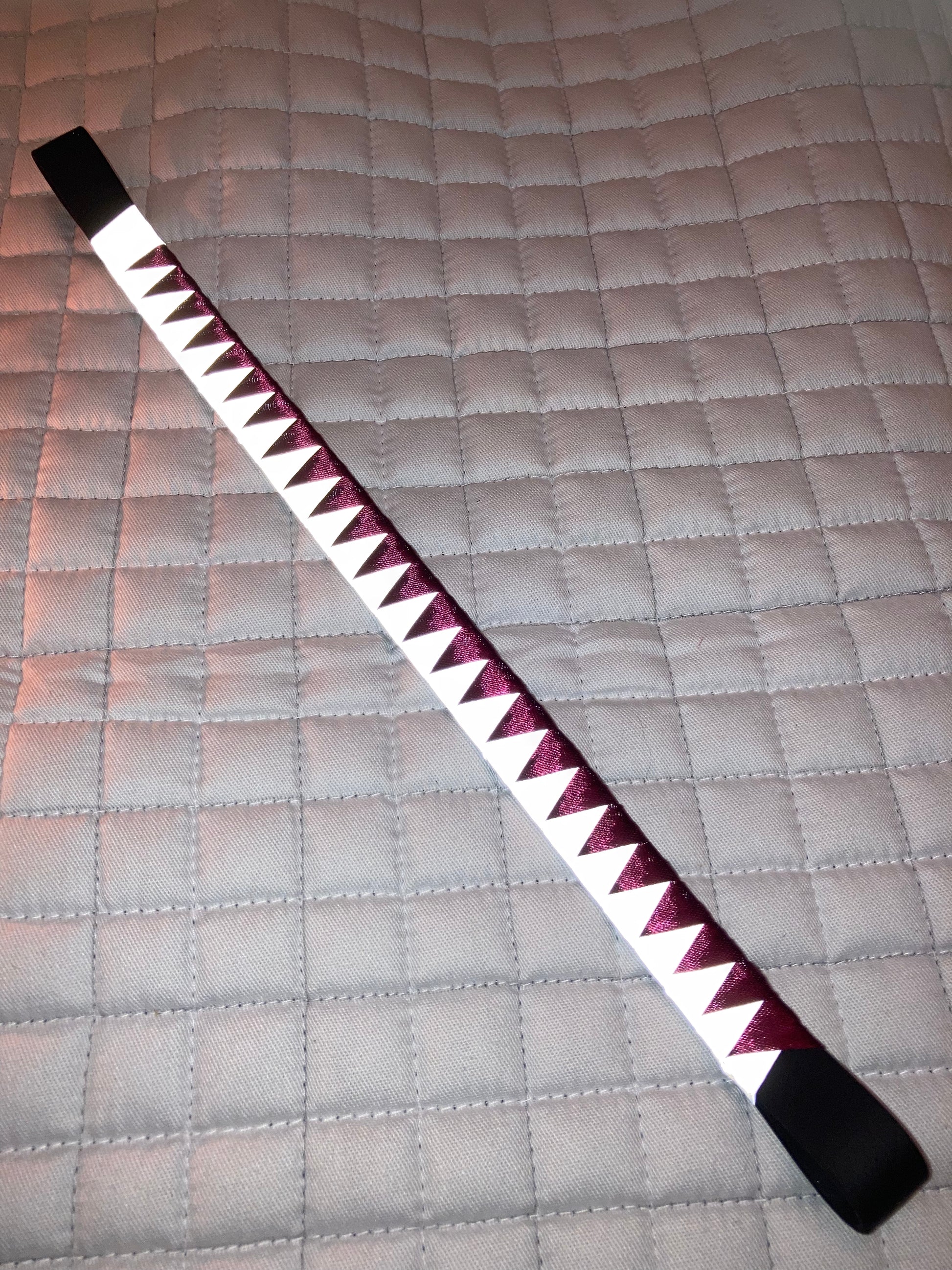a bespoke high viz browband with burgundy ribbon